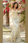 Woman in a gold and silver evening gown with floral background