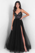 Black lace evening gown with a high slit on a white background