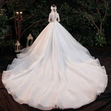 Elegant Lace Bridal Gown with Long Sleeves and Train