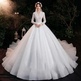 Elegant Lace Bridal Gown with Long Sleeves and Train