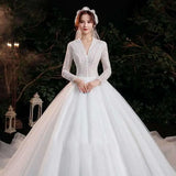 Elegant Lace Bridal Gown with Long Sleeves and Train