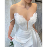 White Satin Gown with Feathers Sweeping the Floor