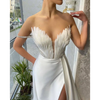 White Satin Gown with Feathers Sweeping the Floor