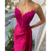 White Satin Gown with Feathers Sweeping the Floor